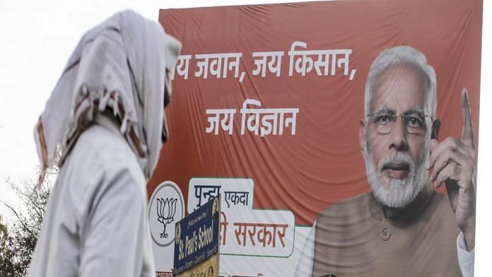 File photo of BJP election campaign hoarding featuring Prime Minister Narendra Modi | Representational image | Photo: Dhiraj Singh | Bloomberg