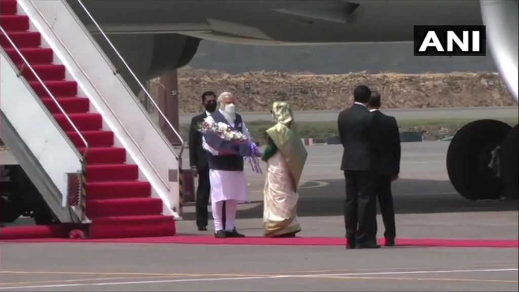 PM Narendra Modi welcomed by his Bangladeshi counterpart Sheikh Hasina at the Dhaka airport, on 26 March 2021 | Twitter/@ANI