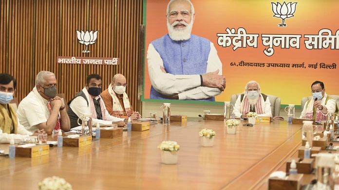 PM Narendra Modi along with BJP National President JP Nadda, Home Minister Amit Shah during an election committee meeting for Assam polls, in New Delhi on 4 March 2021 | PTI Photo