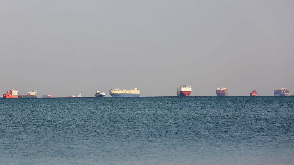 Commercial cargo and container ships ride anchor while waiting to transit the Suez Canal in Ismailia, Egypt, on 25 March 2021 | Photographer: Islam Safwat | Bloomberg