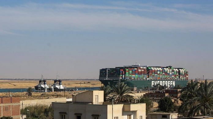 Tug boats pull the Ever Given container ship along the Suez Canal after being freed from the canal bank in Suez, Egypt, on 29 March 2021 | Photographer: Islam Safwat | Bloomberg