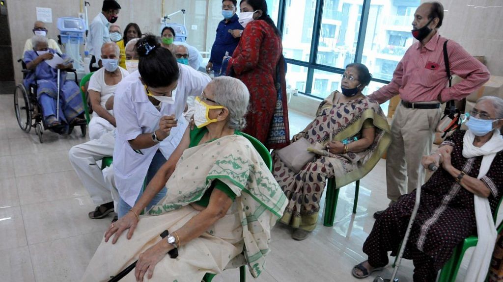A medic administers Covid-19 vaccine to an elderly woman as other senior citizens wait, at Mayors Health Clinic in Kolkata | Representational image | 23 March 2021 | PTI