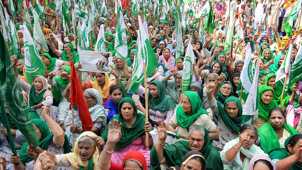 Women from Punjab and Haryana participate in farmers' protest on International Women's Day, at Tikri Border in Delhi, on 8 March 2021 | PTI Photo