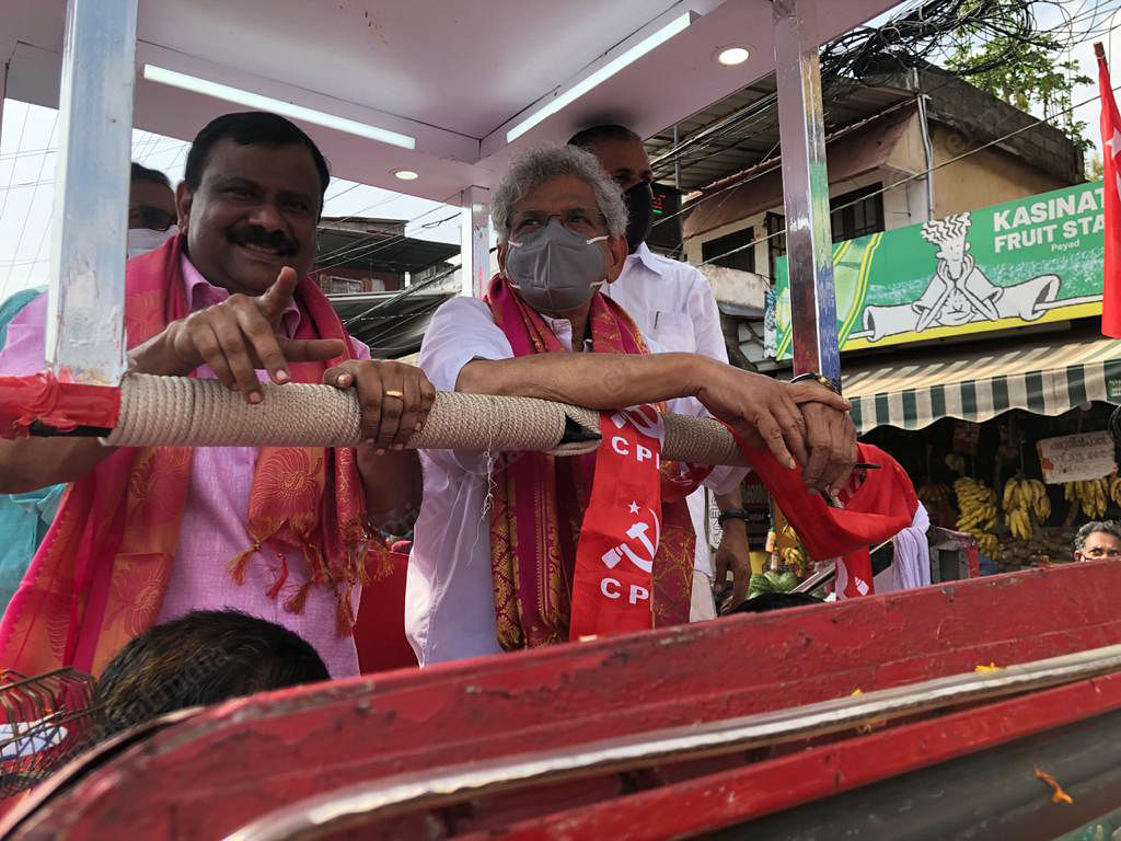 CPM candidate I B Satheesh (left) and general secretary Sitaram Yechury (right) in a poll chariot | Photo: Jyoti Malhotra | ThePrint