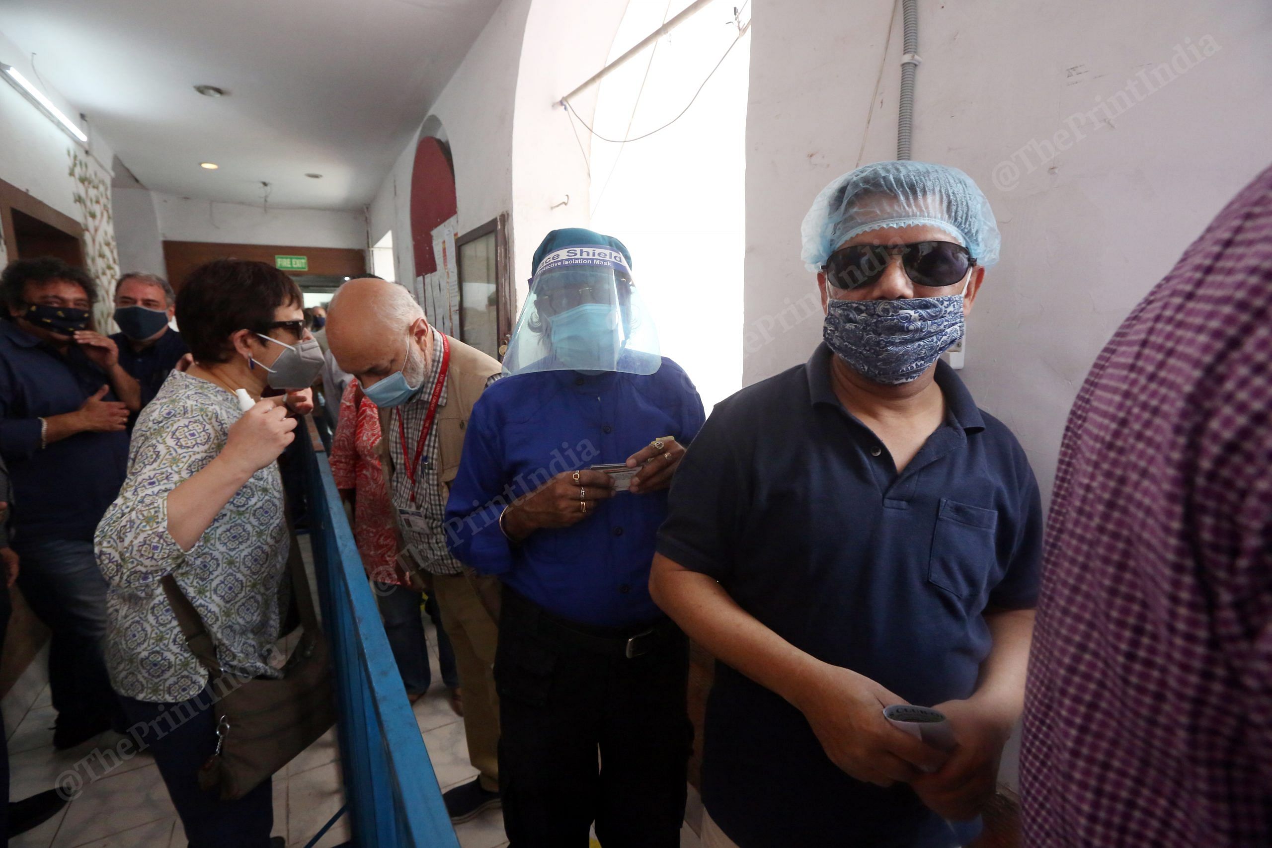 Voters wear come prepared with masks and face shields to vote | Photo: Praveen Jain | ThePrint