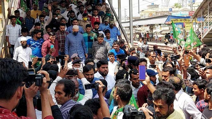 AIMIM chief Asaduddin Owaisi is welcomed by supporters at Sagardighi Railway Station in Murshidabad, in March 2021 | ANI