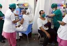 Two beneficiaries receiving Covid-19 vaccinations simultaneously in Dadar, Mumbai | Representational image: ANI