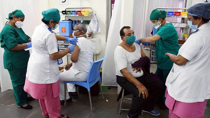 Two beneficiaries receiving Covid-19 vaccinations simultaneously in Dadar, Mumbai | Representational image: ANI