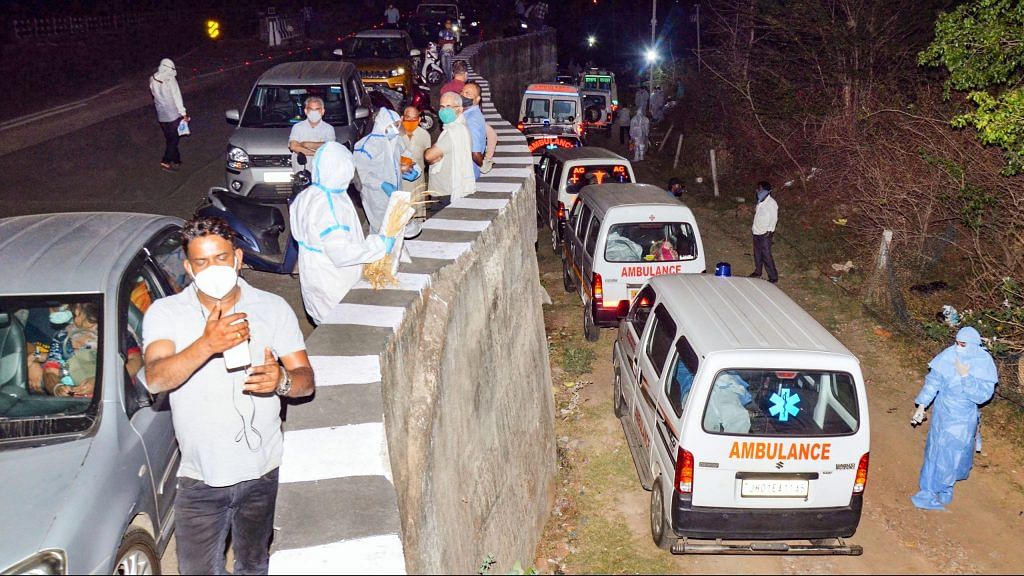 Ambulances, carrying the mortal remains of those who died of COVID-19, stand parked outside a crematorium, in Ranchi on 11 April, 2021 | PTI