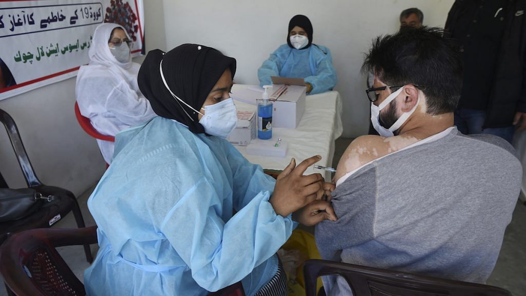 File photo | A man receives a shot of COVID-19 vaccine, in Srinagar | PTI