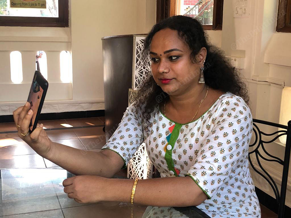Sreemayi, a transgender woman looks at herself in the mirror before a TV panel discussion on 'women and politics' | Photo: Jyoti Malhotra | ThePrint
