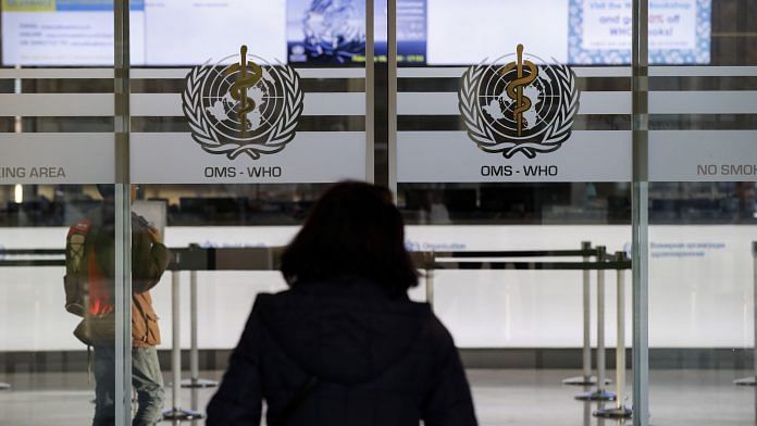 A visitor enters the World Health Organization (WHO) headquarters in Geneva, Switzerland, on Tuesday, Feb. 18, 2020. | Photographer: Stefan Wermuth | Bloomberg