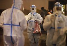 Health workers at a makeshift Covid-19 quarantine facility set up at a banquet hall in New Delhi, India, on Wednesday, April 21, 2021. | Photographer: Anindito Mukherjee | Bloomberg