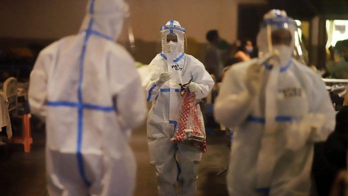 Health workers at a makeshift Covid-19 quarantine facility set up at a banquet hall in New Delhi, India, on Wednesday, April 21, 2021. | Photographer: Anindito Mukherjee | Bloomberg