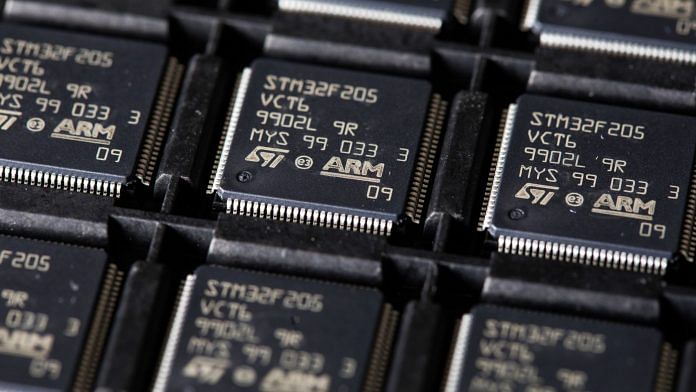 STMicroelectronics STM32F205 integrated circuit microchips (IC's), designed by ARM Ltd., in a storage tray at CSI Electronic Manufacturing Services Ltd. in Witham, U.K| Photographer: Chris Ratcliffe | Bloomberg