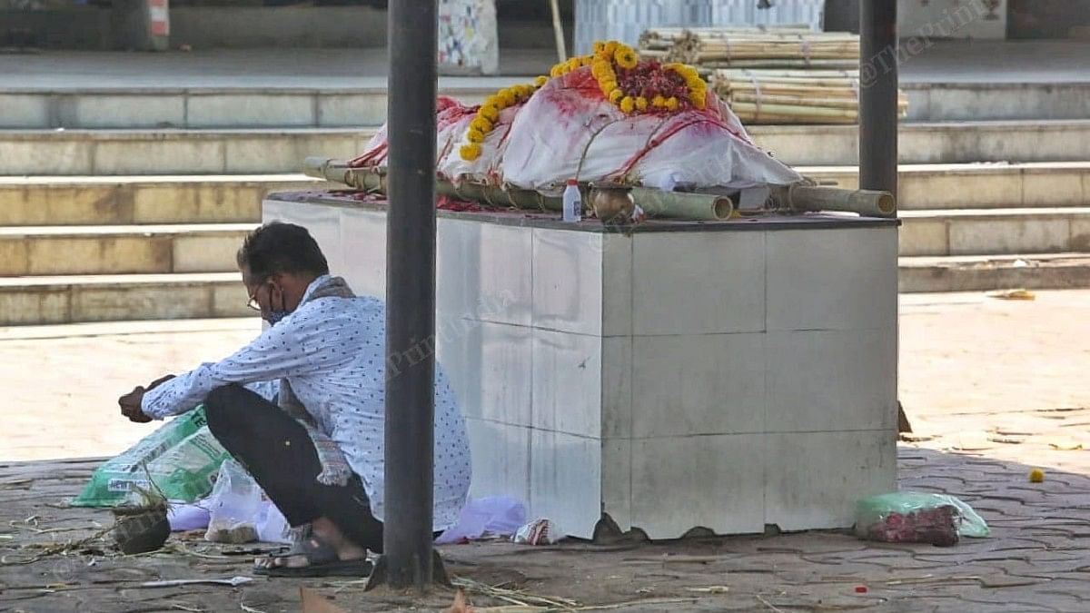 Ahmedabad funeral A man waits for his turn to cremate a relative at the Ellisbridge crematorium in Ahmedabad | Praveen Jain | ThePrint