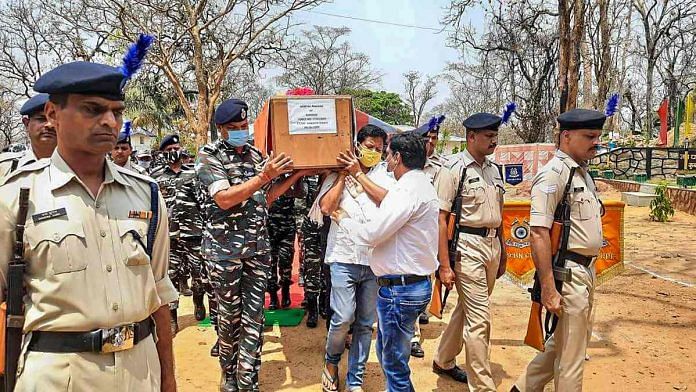 CRPF personnel carry the coffin of a jawan who was killed in the attack by Maoists, in Bijapur district of Chhattisgarh, on 4 April 2021 | PTI