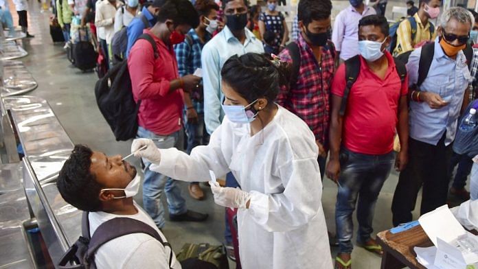 A health worker conducts Covid-19 testing at Chhatrapati Shivaji Maharaj Terminus in Mumbai, on 1 April 2021 | PTI