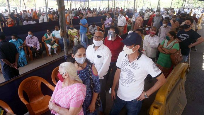 People wait in long queues at a Covid-19 vaccination centre in Goregaon, Mumbai on 5 April 2021 | ANI