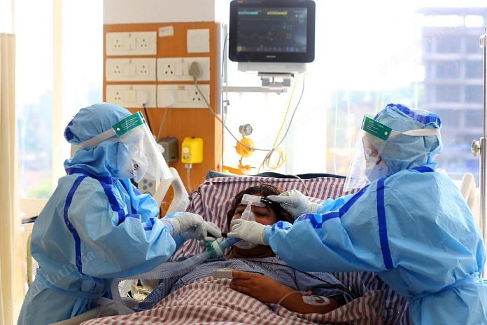 Nurses giving oxygen pump to coronavirus COVID-19 patient in the intensive care unit (I.C.U.) at Ramakrishna Hospital | Photo: Suraj Singh Bisht | ThePrint