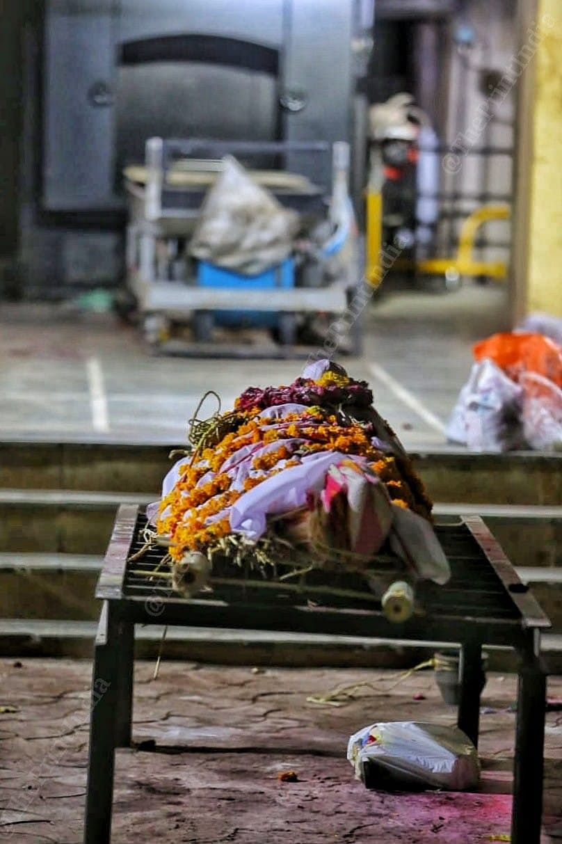 The deceased are queued up for their last rites, this body waits for his turn in Hatkeshwar Crematorium | Photo: Praveen Jain | ThePrint