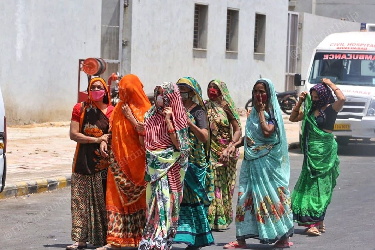 Women of a family wait to receive the body of their loved one at Civil Hospital Mortuary | Photo: Praveen Jain | ThePrint