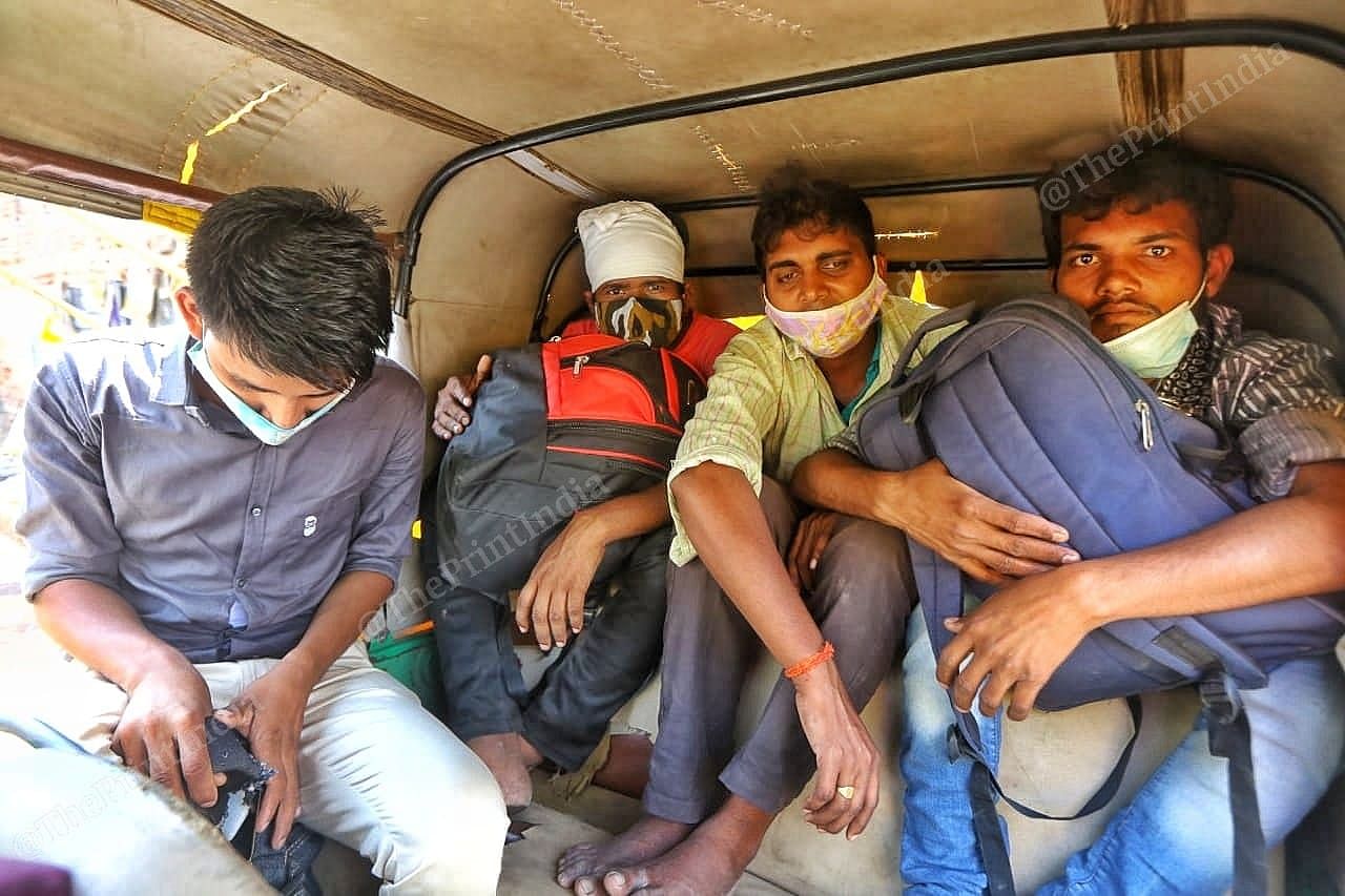 A group of migrants stuff themselves in an auto to reach the Ahmedabad railway station | Photo: Praveen Jain | ThePrint