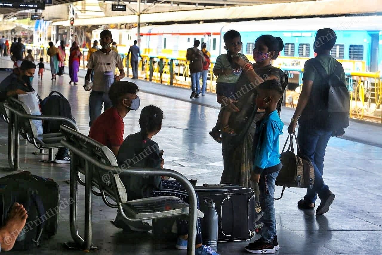 A family of migrants wait for their train on platforms | Photo: Praveen Jain | ThePrint