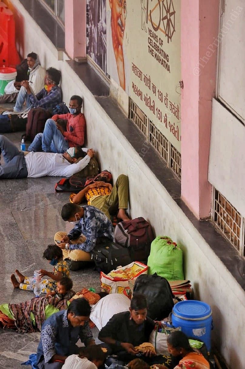 A group of migrants have their lunch and nap | Photo: Praveen Jain | ThePrint