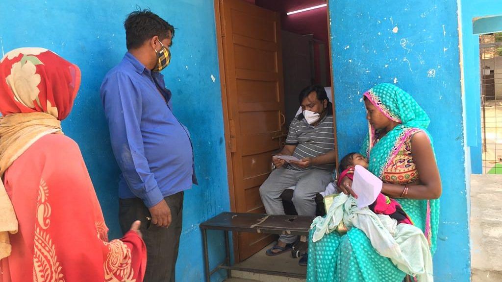 Dr Shailendra Kumar Singh, incharge of community health centre at Shankargarh, attends to patients in his house | Photo: Moushumi Das Gupta/ThePrint 