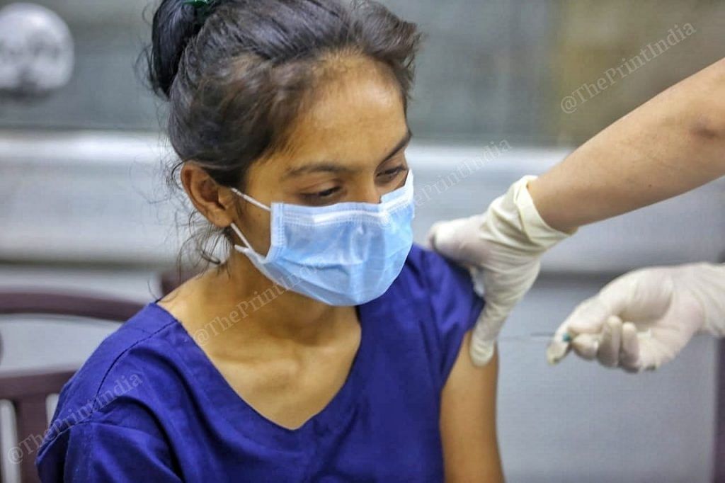 A healthcare worker in Ahmedabad gets her shots | Representational image | Photo: Praveen Jain | ThePrint