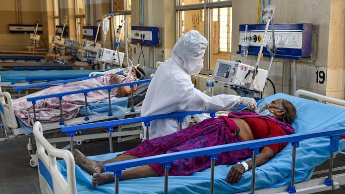 A health worker attends to Covid-19 patients at a Covid ICU Ward in Hyderabad, on 27 April 2021 | PTI Photo
