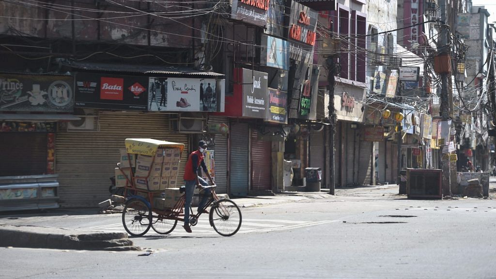 Closed shops at Vikas Marg, during weekend lockdown imposed in the wake of rising Covid-19 cases across the country, in New Delhi, Saturday, 17 April, 2021. | PTI