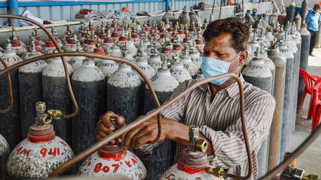 An employee refilling cylinders at an oxygen plant in Meerut, on 28 April 2021 | Representational image | PTI