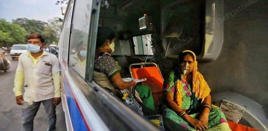 File photo of a woman being administered oxygen in an ambulance outside a hospital in Ahmedabad | Praveen Jain | ThePrint