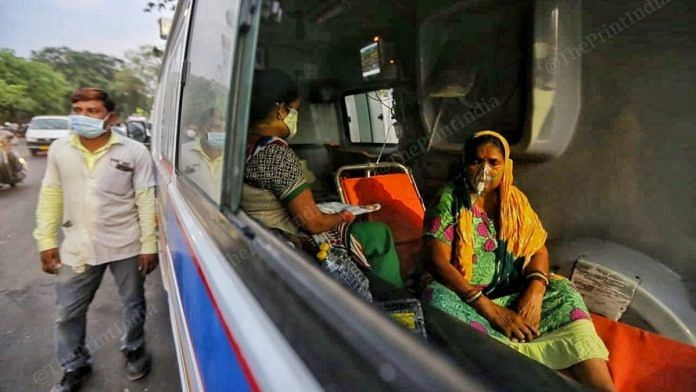 File photo of a woman being administered oxygen in an ambulance outside a hospital in Ahmedabad | Praveen Jain | ThePrint
