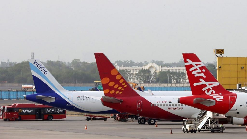 Aircraft stand at Terminal 3 of Indira Gandhi International Airport in New Delhi | Photographer: T. Narayan | Bloomberg
