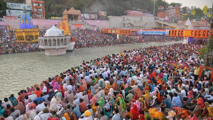 Devotees gather at Har Ki Pauri Ghat to offer prayers during Kumbh Mela in Haridwar on 11 April 2021 | PTI Photo