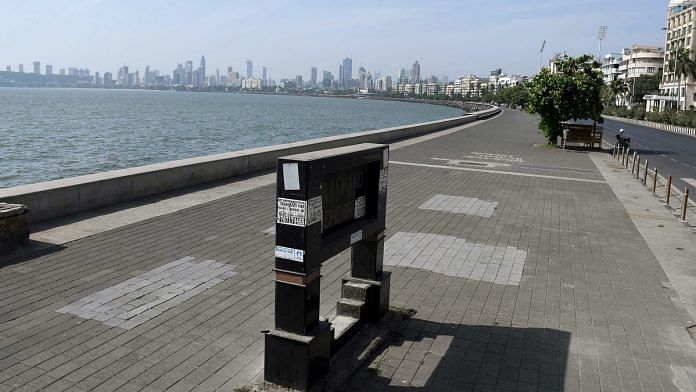 A view of deserted Marine Drive after curfew-like restrictions were imposed across Maharashtra, in Mumbai on 20 April.| Photo: ANI