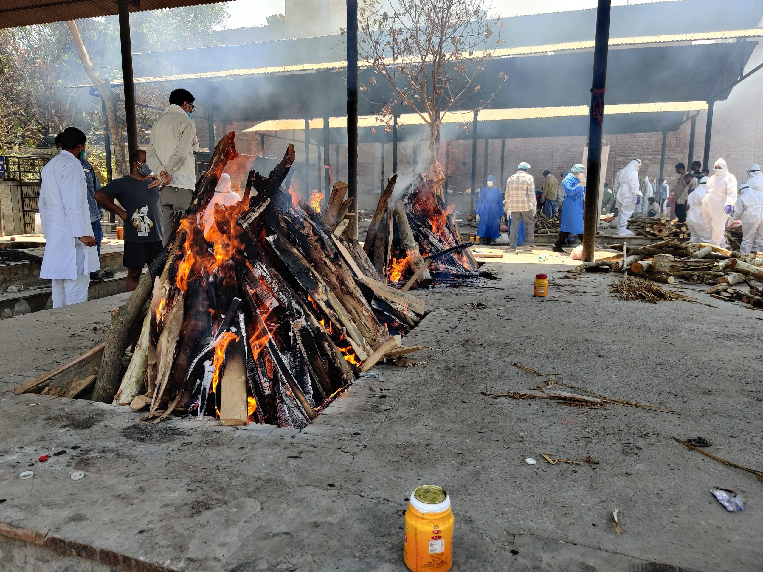 A pyre in flames at An ambulance outside Seemapuri crematorium | Bismee Taskin | ThePrint