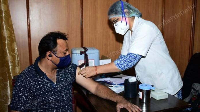 A person being vaccinated against Covid in Jaipur | Rohit Jain Paras | ThePrint