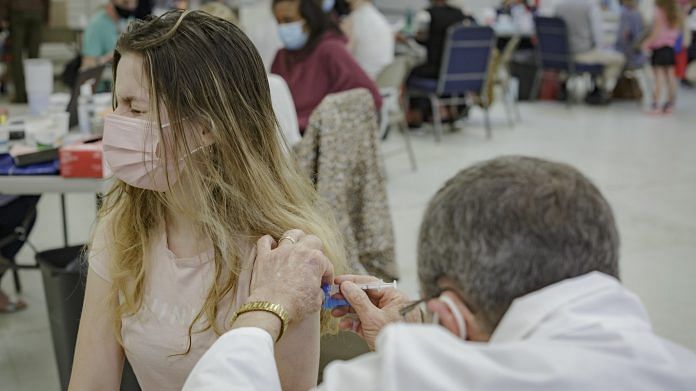 A healthcare worker administers a vaccine to a resident in Lynchburg, Virginia, US, on 10 April 2021 | Bloomberg