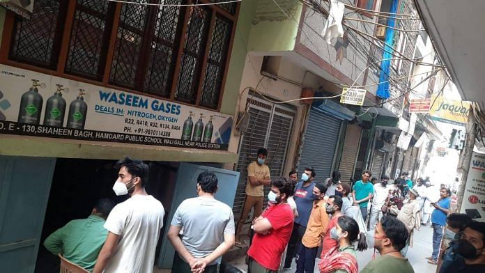 People waiting for oxygen outside Waseem Gases in Delhi's Shaheen Bagh | By special arrangement