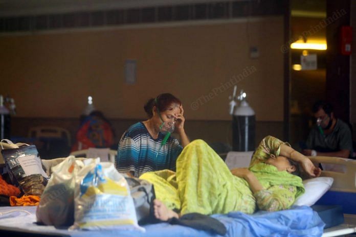 The Shehnai banquet hall is a covid facility that was opened last year. The facility is currently overburdened unlike last year. This facility did not have oxygen cylinders, but it does have now, as most of the patients complaint of breathing difficulties | Suraj Singh Bisht | ThePrint
