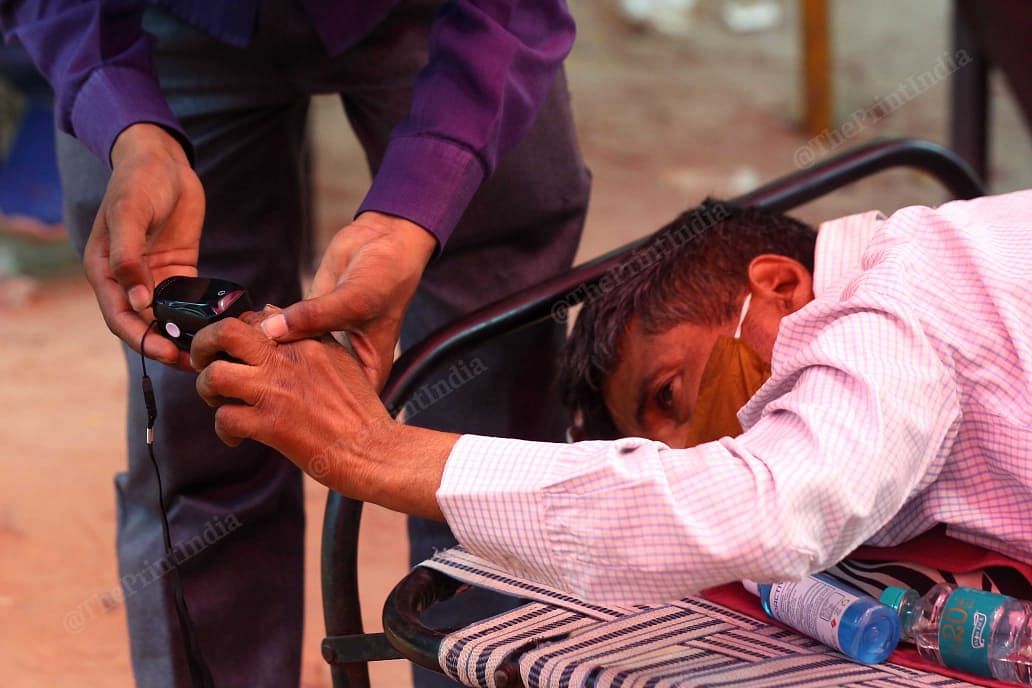 Around Delhi and NCR, the Sikh committee have organised oxygen langar. In the facility, a doctor checks the oxygen levels of a patient | Suraj Singh Bisht | ThePrint