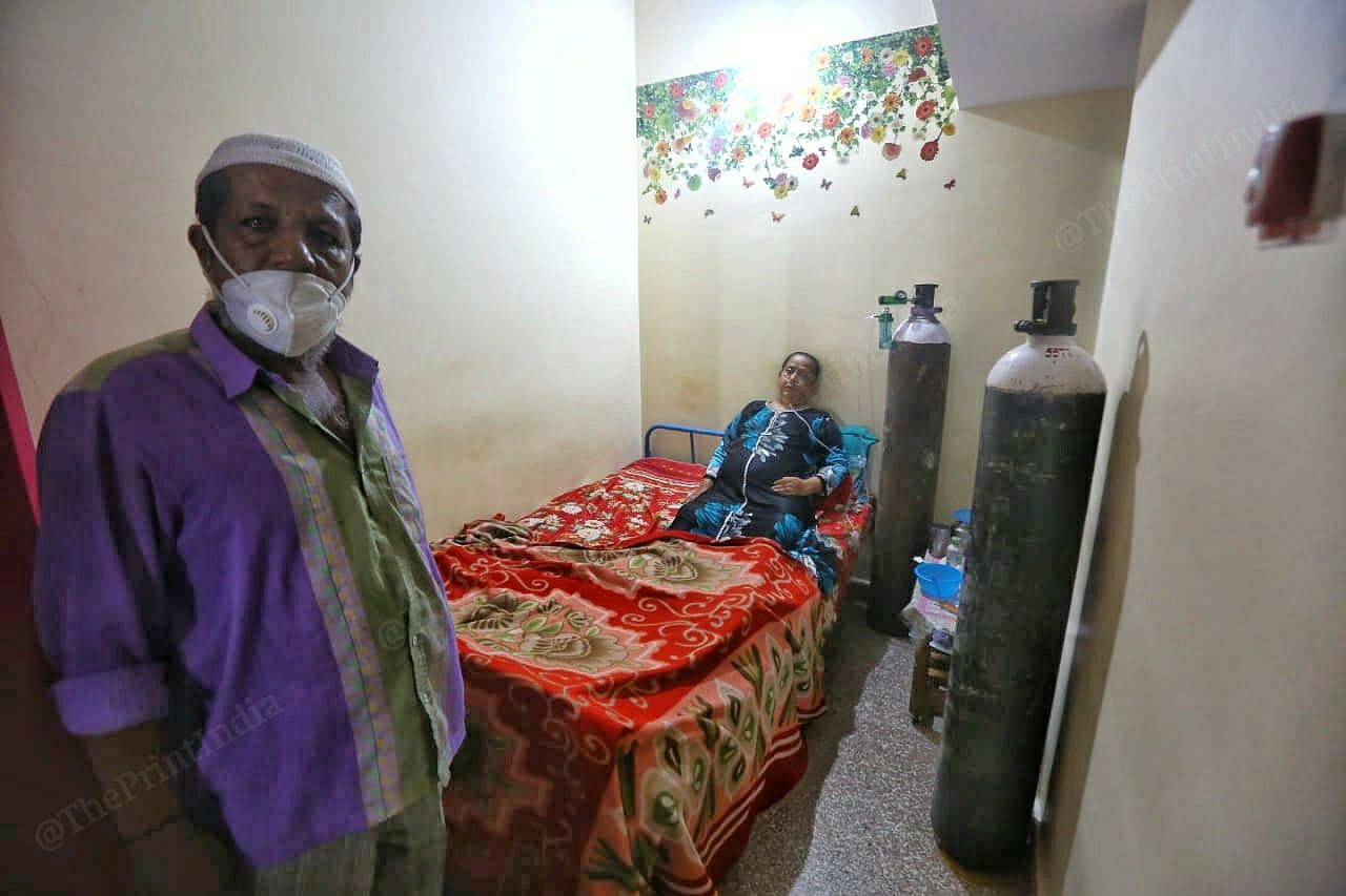 Mohammad Sadiq and his wife Shaheeda Khatoon at their house with oxygen cylinder. | Photo: Praveen Jain/ThePrint