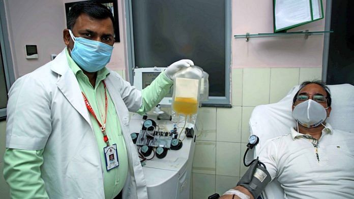 A doctor holds up plasma collected from a patient (representational image): | Photo: ANI