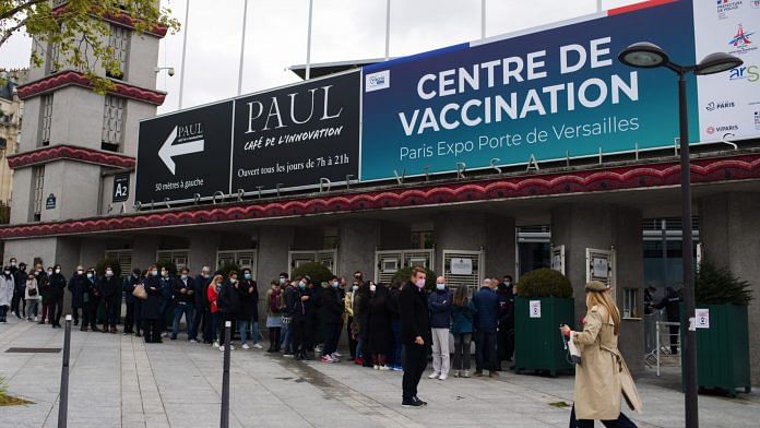 Visitors queue for surplus vaccines at the Covid-19 'vaccinodrome' vaccination site at the Porte de Versailles exhibition center in Paris, France, on Thursday, May 6, 2021. The head of the European Unions executive arm mounted a spirited defense of the blocs Covid-19 vaccination campaign, taking a swipe at countries like the U.S. and the U.K. as she hailed her region as the worlds top vaccines exporter. Photographer: Nathan Laine/Bloomberg