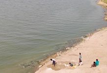Labourers dig graves beside the Ganga in Gahmar, Ghazipur district, to dispose of hundreds of bodies floating down the river | Photo: Sajid Ali | ThePrint