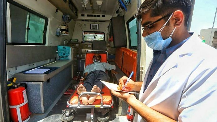 Representational image | A doctor checks a patient's status in an ambulance | Praveen Jain ThePrint